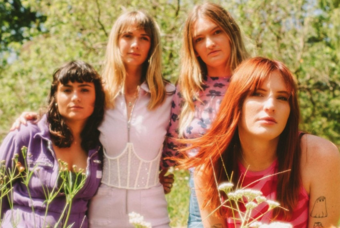 Betty Taylor looking down the camera with trees in the background